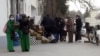 Turkmen line up outside a grocery shop to buy food in the capital, Ashgabat. 