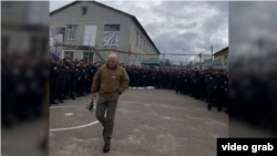 In this snapshot from a video on the Popular Politics channel, a man resembling Prigozhin is seen recruiting prisoners to take part in the fighting in Ukraine in September 2022.