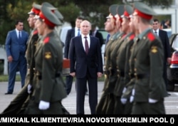 Russian President Vladimir Putin watches a parade during a visit to the 201st Russian military base in Tajikistan in October 2012.