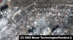 The smoldering ruins of a residential area in Mariupol on March 29.