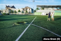 Damage from shelling in a sports field in Irpin.