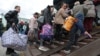 Civilians evacuated from the Russian-occupied Kherson region of Ukraine arrive at a railway station in the town of Dzhankoi, on the Russia-annexed Crimean Peninsula, on October 20.