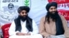 Tehrik-e Taliban Pakistan (TTP) chief Noor Wali Mehsud (left) with another movement leader in an undisclosed location. (file photo)