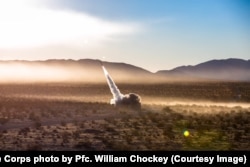 A precision-guided rocket is launched from an HIMARS at a firing range in California in 2017.