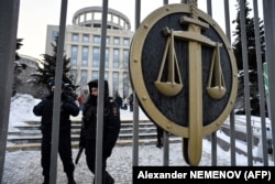 Police officers outside the Moscow City Court on December 29, as it declared that the Memorial Human Rights Center must be liquidated.