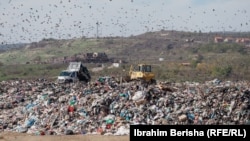 Crows fly above the massive state owned landfill of Mirash in Kosovo.