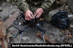 A Ukrainian soldier in Illya Lif's unit working with an first-person view (FPV) drone.