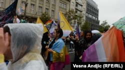 Pride supporters march in the streets of Belgrade on September 17.