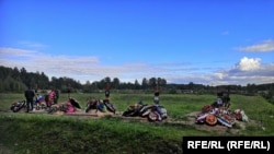 The freshly dug graves of five men who appear to have died in fighting in Ukraine, at the Petergof cemetery in St. Petersburg. 