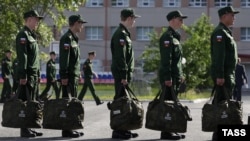 Army conscripts line up at the Yegorshino regional assembly station before departing for service with the Russian Army.