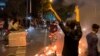 A photo obtained by AFP shows a demonstrator making the victory sign during a protest for Mahsa Amini in Tehran on September 19.