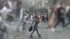 Iranian Protesters Chase Police In Tabriz As Nationwide Protests Continue video grab 1