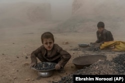 Afghan children work at a brick factory on the outskirts of Kabul.