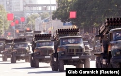 Military vehicles of Moldova's self-proclaimed separatist Transdniester region take part in a military parade during Independence Day celebrations in Tiraspol in 2010.