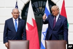 U.S. President Donald Trump (right) and Israeli Prime Minister Benjamin Netanyahu attend a signing ceremony on the South Lawn of the White House in Washington in September 2020.