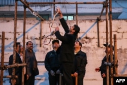 Iranian officials prepare for a public execution in the northern city of Nowshahr in 2014