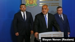 Bulgarian Prime Minister Boyko Borisov (center) speaks next to chief prosecutor Sotir Tsatsarov (right) and Interior Minister Mladen Marinov in Sofia on October 10.