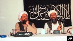 Osama bin Laden (right) holds a news conference in Afghanistan in 1998 with with his future successor, Ayman al-Zawahiri (left), who currently leads Al-Qaeda.