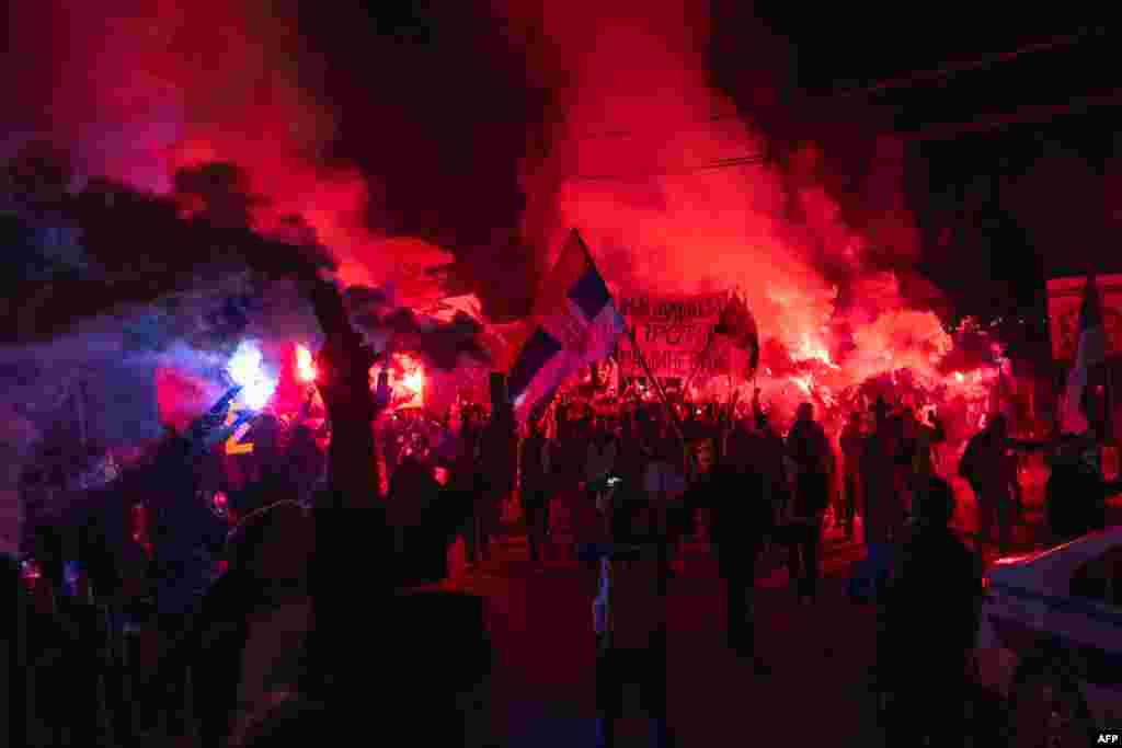 Protesters light flares in the town of Svrljig amid ongoing demonstrations across Serbia following the deadly collapse of a railway station canopy in Novi Sad late last year. 