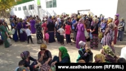 People line up outside a state grocery store to buy cooking oil in the Turkmen city of Mary.