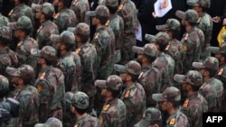 IRGC cadets attend the funeral of Razi Musavi, a senior commander in the Quds Force who was killed on December 25 in an Israeli strike in Syria, in Tehran on December 28.