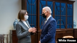 Belarusian opposition leader Svyatlana Tsikhanouskaya (left) meets with U.S. President Joe Biden at the White House on July 28. 