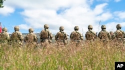 New recruits to the Ukrainian Army are trained by British Army specialists at a military base near Manchester, England, on July 7.