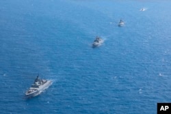 Russian warships sail during a naval drill in the Mediterranean Sea outside of Tartus on September 12.