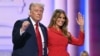 Former U.S. President and 2024 Republican presidential candidate Donald Trump raises a fist next to his wife, Melania, during the last day of the 2024 Republican National Convention in Milwaukee, Wisconsin, on July 18. 