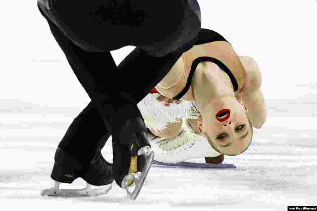 Uzbekistan's Ekaterina Geynish and Dmitriy Chigirev perform during the Mixed Pair Skating Free Skating in Harbin, China.