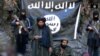 IMU leader Usmon Ghazi and his fighters are shown taking an oath of allegiance, in Arabic, to IS and its leader Abu Bakr al-Baghdadi.