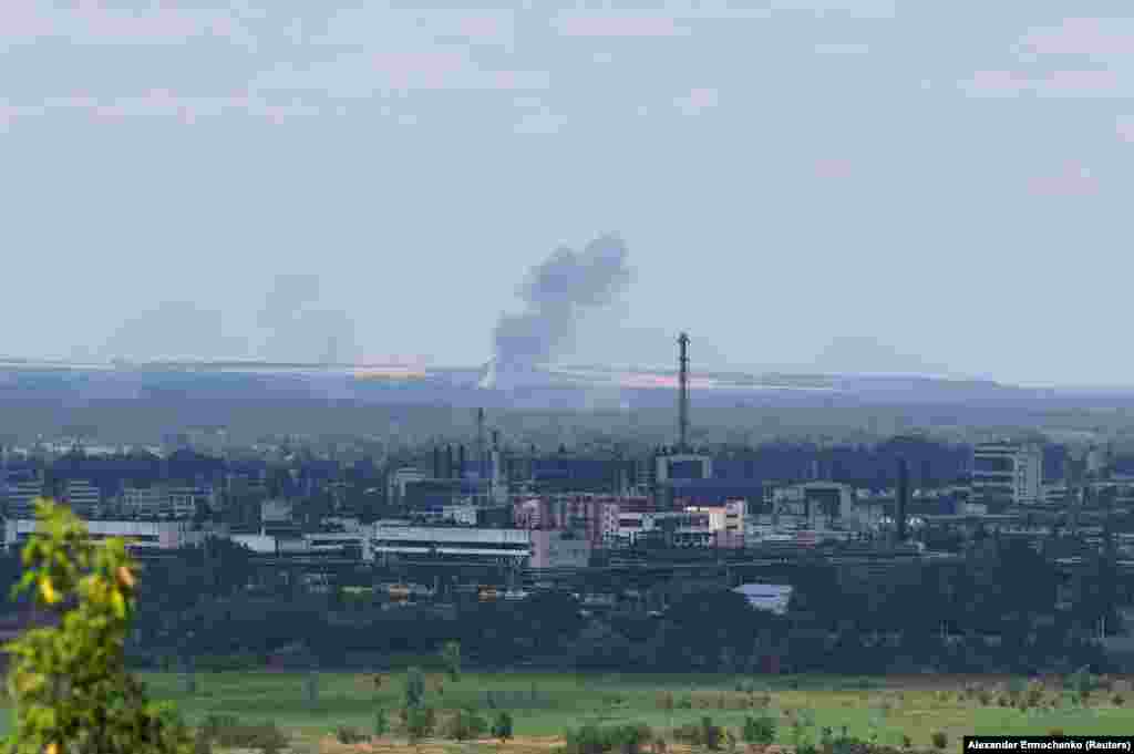 A view of the Azot chemical plant in the foreground as artillery barrages hit positions behind it.&nbsp;Russian President Vladimir Putin has directed his troops to continue their offensive, shelling the Ukrainian strongholds of Slovyansk and Kramatorsk deeper into the Donetsk region.