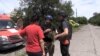 Volunteers try to convince one resident of Lysychansk to evacuateamid the constant Russian shelling.