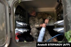 A Ukrainian soldier prepares to fire artillery near the city of Lysychansk on June 14.