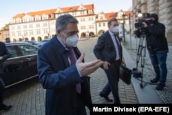 Russian Ambassador to the Czech Republic Aleksandr Zmeyevsky (left) arrives for a meeting with Czech Foreign Minister Jakub Kulhanek (right) in Prague last month.