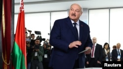 Belarusian authoritarian ruler Alyaksandr Lukashenko votes during the presidential election in Minsk on January 26.