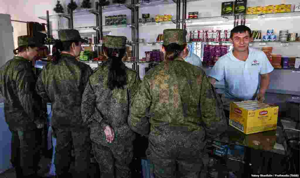 Russian servicewomen wait at a store inside the Hmeimim base in February 2016. Dubow said Moscow might be able to negotiate a reduced foothold in Syria, &quot;to continue possessing vital transit stations for projecting power across the Middle East and Africa.&quot; &nbsp;