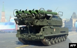 A Russian air-defense system Buk-2M armored launcher parades on Red Square in Moscow during the Victory Day parade on May 9, 2013.