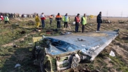 Investigators inspect wreckage at the PS752 crash site near Tehran.