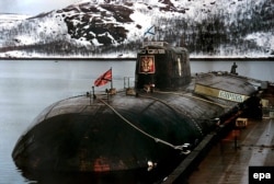 An undated photo of the ill-fated Kursk submarine at her mooring at a base in Vidyayevo, Russia.