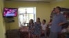 A family in Tajikistan watches television. 