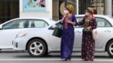 Women wear face masks as a preventive measure against the spread of COVID-19 in Ashgabat despite claims by the Turkmen government that the virus does not exist there. 