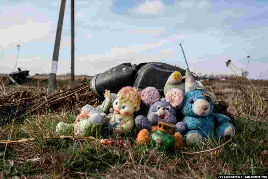 Toys left by local residents in memory of dozens of children who were among the victims.