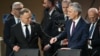 NATO Secretary-General Jens Stoltenberg (right) and Polish President Andrzej Duda participate in a working session of the NATO summit in Washington on July 11.