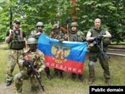 Aleksei Milchakov (second from right) with pro-Russia fighters in eastern Ukraine in 2014.