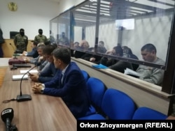 A court in Astana tries 14 Kazakhs repatriated from Syria on terrorism-related charges in December 2019.