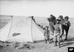 A nomadic herder and his daughter on Mongolia’s plains in March 1936