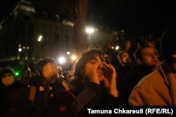 Protestors gather outside the Georgian parliament building in central Tbilisi on November 28.