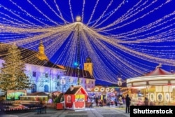 A Christmas market at twilight in the Transylvanian town of Sibiu.