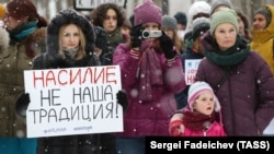 Moscow protesters against the 2017 partial decriminalization of domestic violence hold a placard reading: "Violence is not our tradition!"